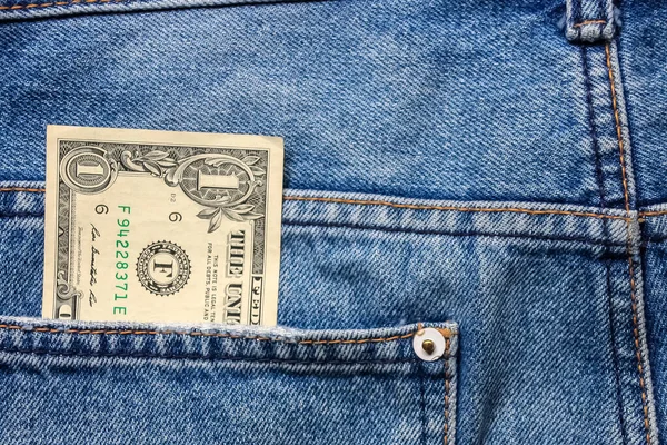 money in back blue jeans pocket denim background texture.