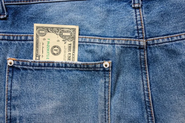 バックブルージーンズポケットデニムの背景の質感でお金 — ストック写真