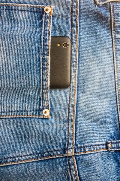 Teléfono Móvil Inteligente Negro Espalda Vaqueros Azul Bolsillo Denim Textura —  Fotos de Stock