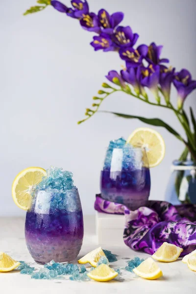 Butterfly pea flower blue ice lemonade with lemon and coconut syrup