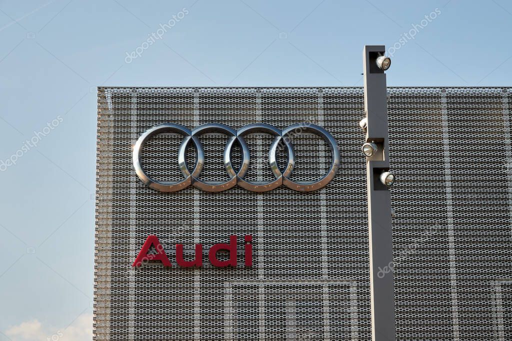 Goeppingen, Germany - May 21, 2020: Audi workshop from the outside, red company logo with the 4 rings on a gray facade. goeppingen.