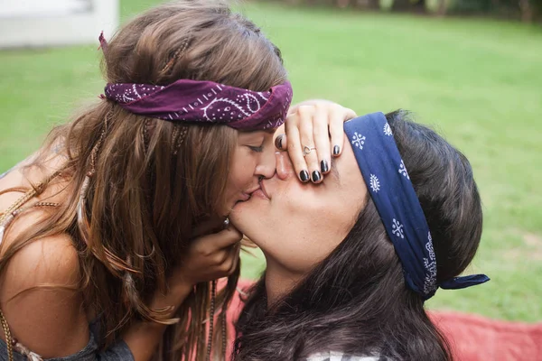 Close half-face portrait of a beautiful girl kissing an attractive guy. Woman covers mans eyes with her hand — Stock Photo, Image