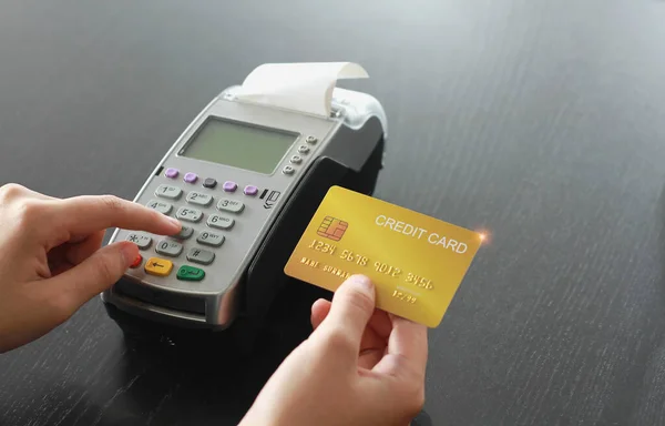 Credit card swipe machine for sell products in the shop. Concept of spending via credit card.