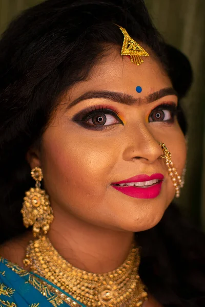 an indian girl with reception party makeup