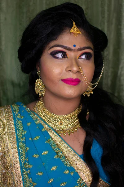 an indian girl in reception party makeup