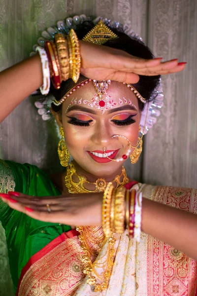 an indian woman with bridal makeup