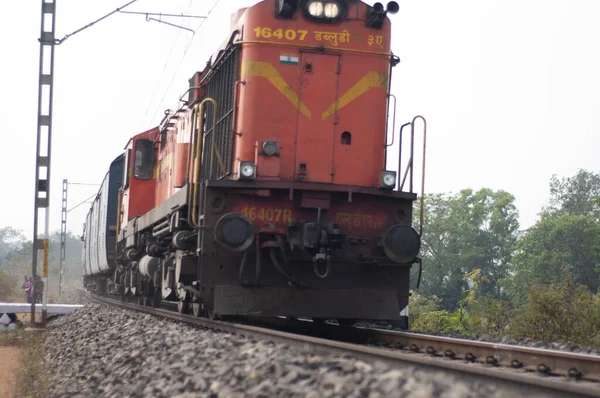 Khirai Midnapore, West Bengal, India - 11th October 2020 : a passenger train of Indian Railway accelerating.