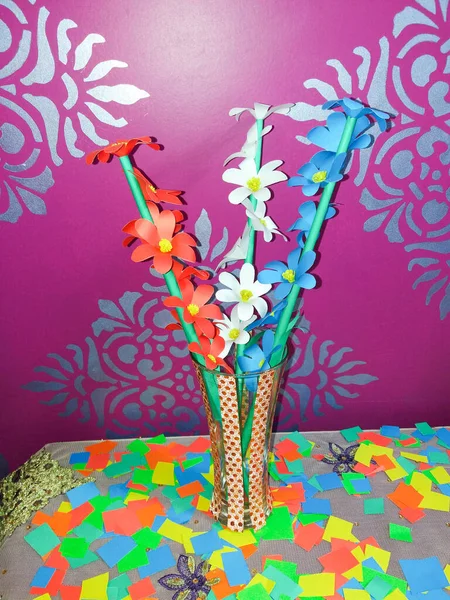 Colorful homemade origami paper flower, DIY floral paper craft, flower paper style, DIY home decoration.