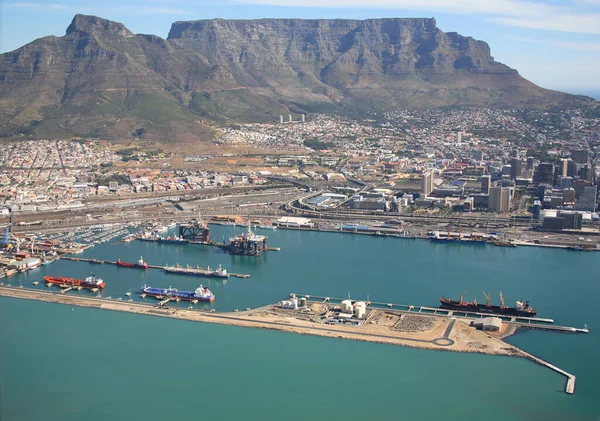 Cape Town, Western Cape / South Africa - 03/23/2008: Aerial photo of vessels and an oil rig at Table Bay Harbour with Table Mountain in the background