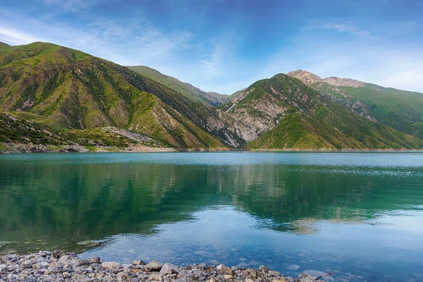 Beautiful mountain turquoise color lake Karasuu in Tian-Shan, Kyrgyzstan.