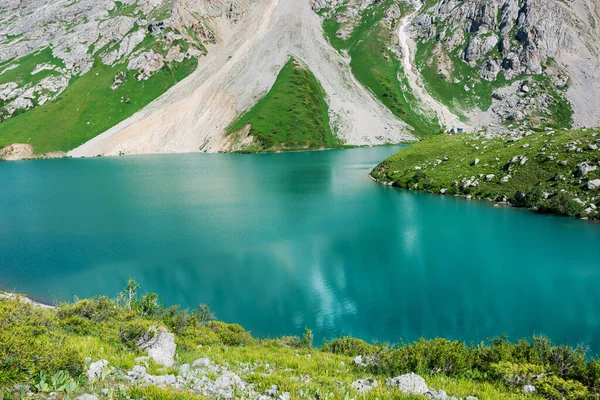Beautiful mountain turquoise color lake Colculan. Kyrgyzstan.