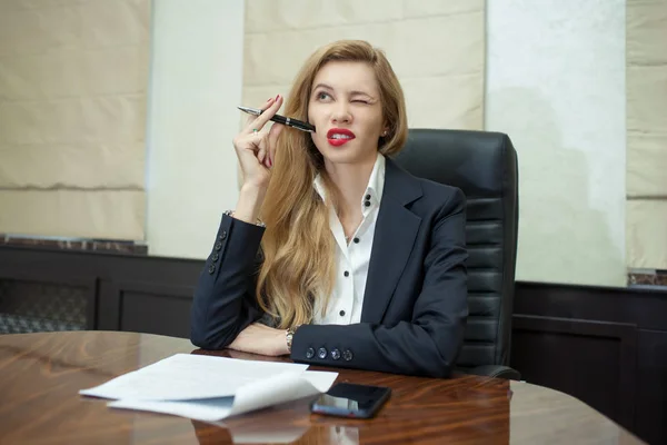 Businesswoman think looking up to empty copy space, young attractive business woman think, idea, hold folder pen on chin. concept pondering in modern office