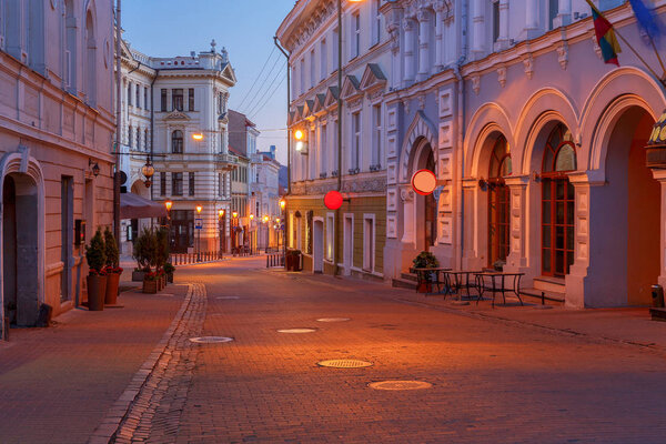 Street in night lighting in the historic center of the old town. Lithuania. Vilnius.