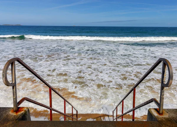 San Malo. Tidal wave on the city beach.