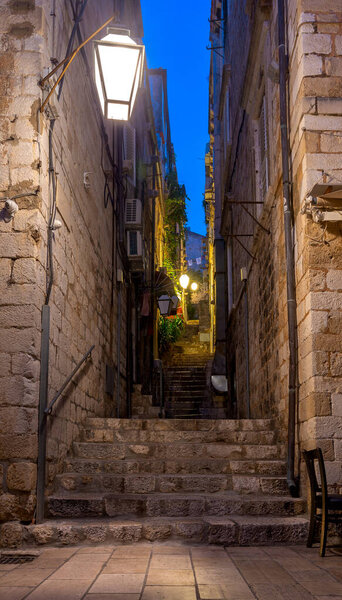 Old narrow medieval street in the historical part of the city at night. Dubrovnik. Croatia.
