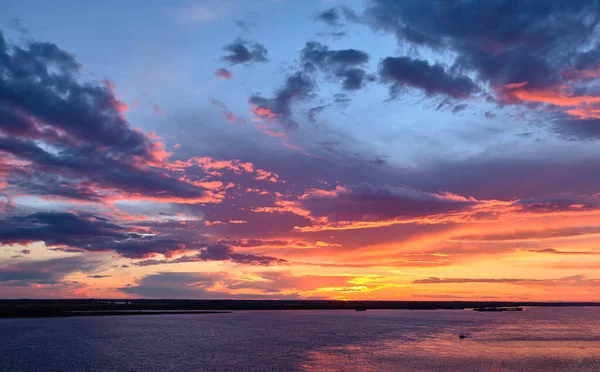Sunset sky over Amur river Stock Photo