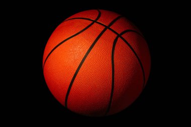 Basketbol, siyah bir arkaplanda spor ve spor sembolü olarak izole edilmiştir.