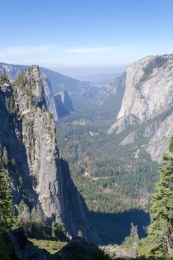 El Capitan and Sentinel rocks from the 4 mile trail at Yosemite National Park clipart