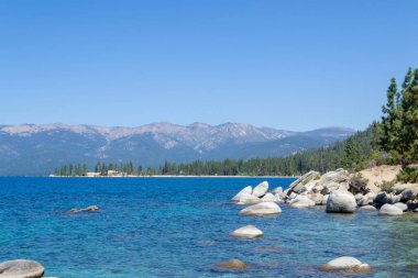 Lake Tahoe is a freshwater alpine lake located in the Sierra Nevada clipart