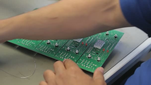 Assembling Circuit Boards Worker Checks Boards Errors — Stock Video