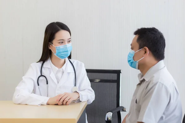 Asian Woman Doctor Talking Man Patient His Pain Symptom While — Stock Photo, Image