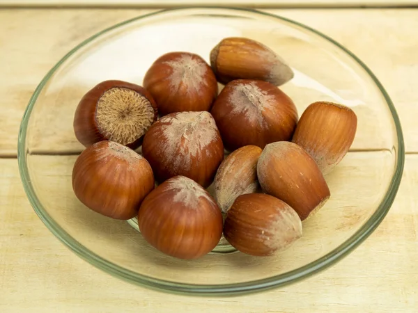 Hazelnuts Glass Plate Wooden Background — Stock Photo, Image