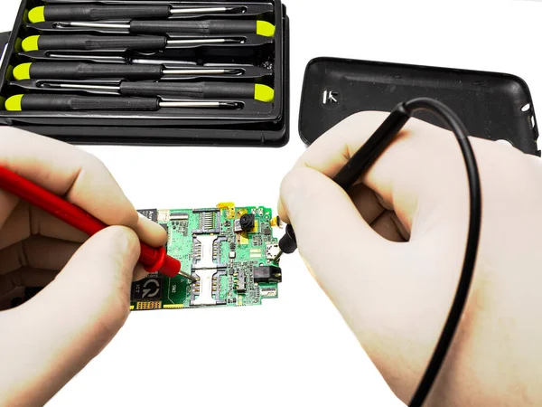 Mobile phone repair with tester and screwdriver isolate