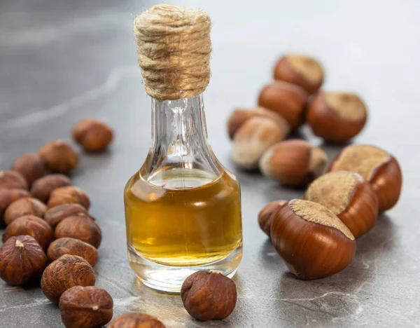 Oil Bottle Nuts Marble Background — Stock Photo, Image