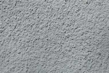 Beton duvarın arka planı ve dokusu. Kabartmalı beton duvar