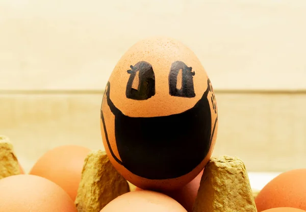 Chicken egg in a black mask