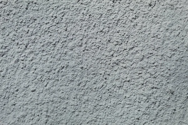 Beton duvarın arka planı ve dokusu. Kabartmalı beton duvar
