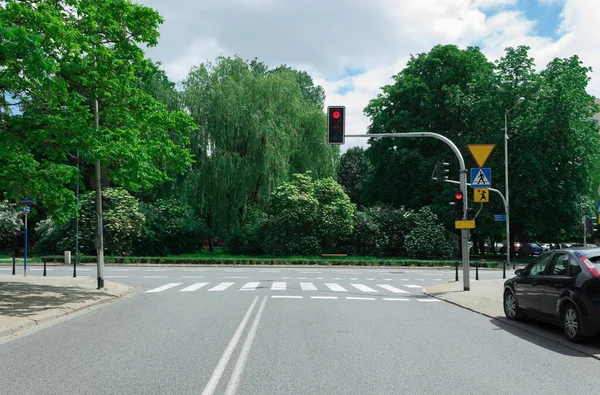 Red traffic light at a crossroads. Prohibitory traffic light sign
