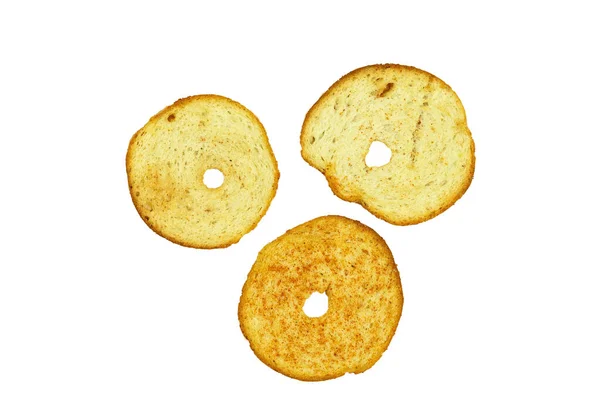 Round toasts of white bread on an isolated white background. Fresh and crispy white bread croutons with spices — Stock Image Toasts White Bread Isolated White Background Fresh Crispy White Bread Royalty Free Stock Photos
