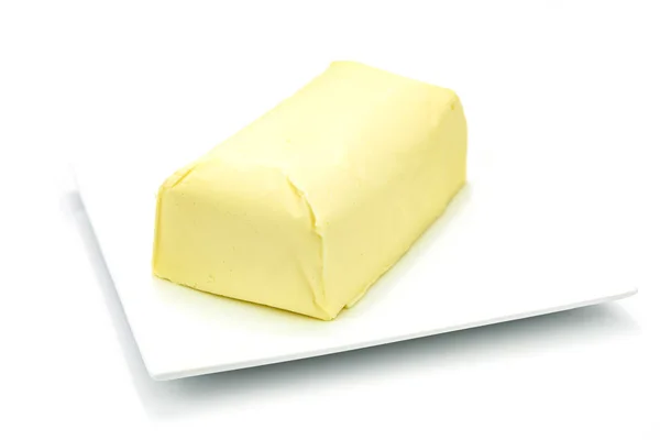 Масло на тарелке Стоковое Фото