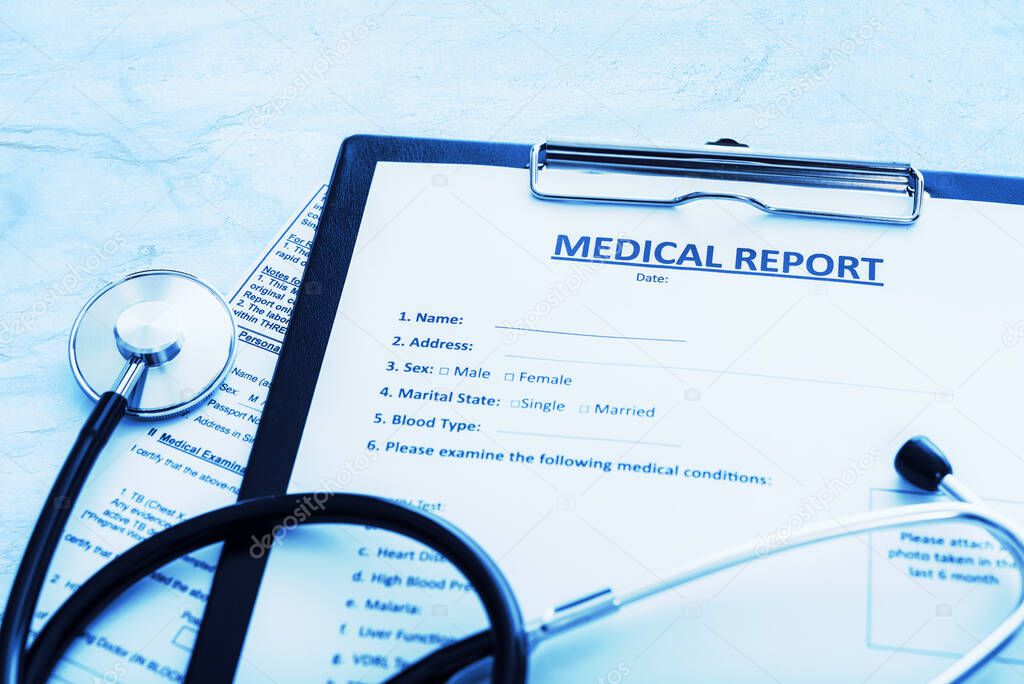 Patient treatment concept - medical report documents with pen and stethoscope in close-up (blue toned image)