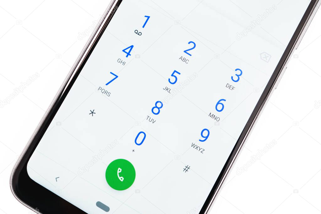 Modern smartphone screen with numbers dialing keypad in close-up on a white background