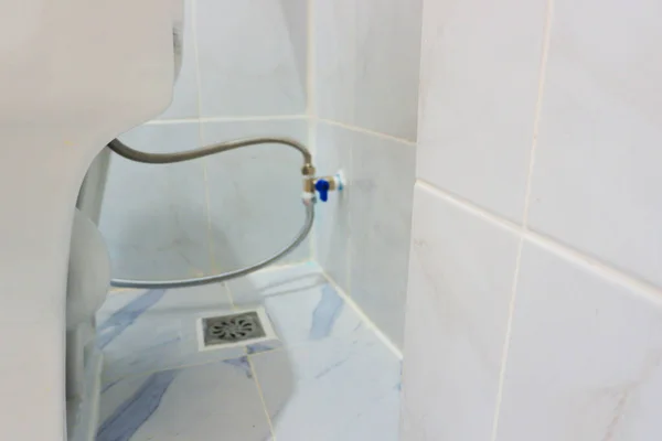 Installation of sanitary ware and valves in bathroom