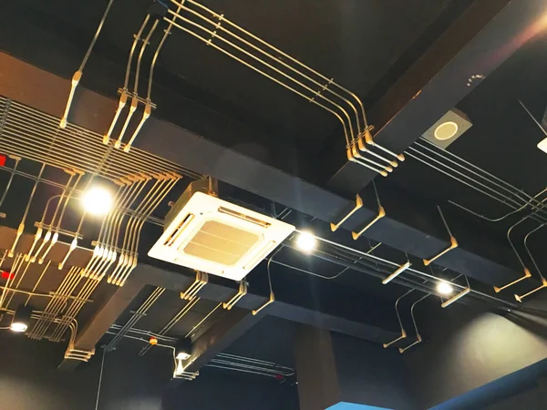 Electrical systems and air conditioning systems are installed on the ceiling.