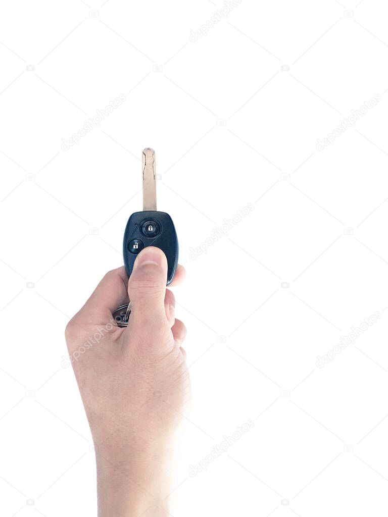 Hand holding a remote control car keys on a white background.