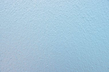 Yeni beton duvar dokusu boya üstüne boya, yarı gölge ve pastel renkte.