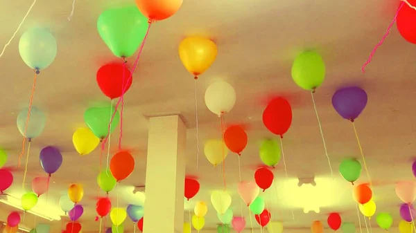 Decorating with balloons at work party.The colors of beautiful balloons are beautiful.
