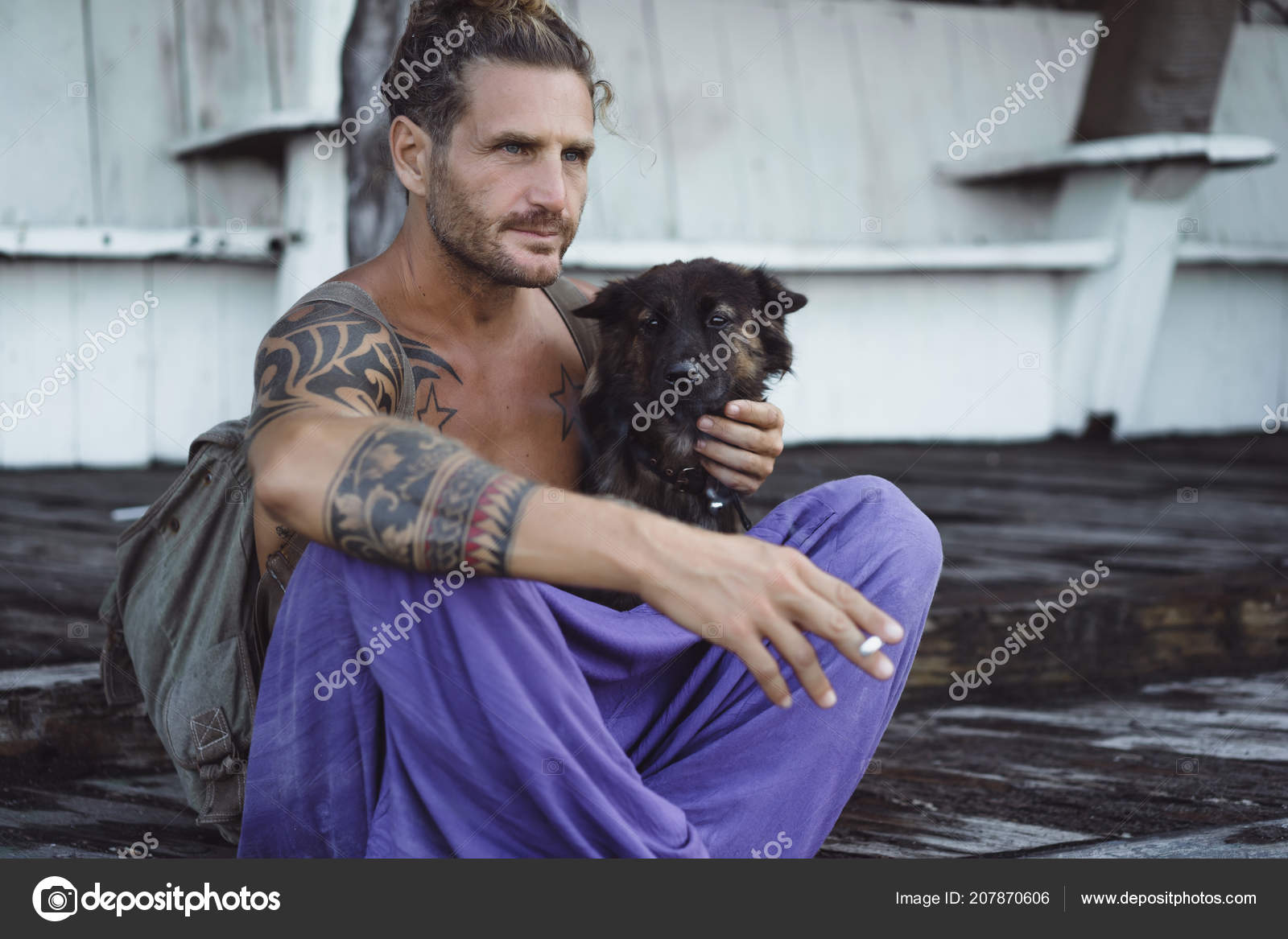 Handsome Adult Man Long Blond Hair Tattoos Playing Dog Stock