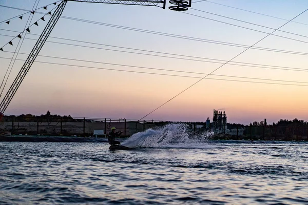 wakeboard. wakeboarding jumping at sunset