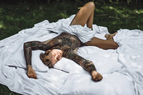 Handsome Young Man Tattoos Relaxing Bed — 스톡 사진