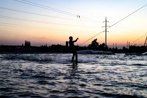 wakeboard. wakeboarding jumping at sunset
