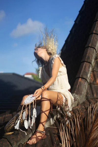 Indian girl on the roof. Dream catchers. beautiful blonde girl with dream catchers.