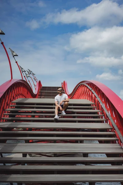 man on the bridge in amsterdam, python bridge