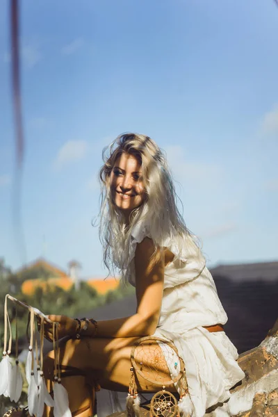 Indian girl on the roof. Dream catchers. beautiful blonde girl with dream catchers.