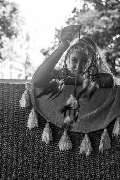 Indian girl at home. Dream catchers. beautiful blonde girl with dream catchers.