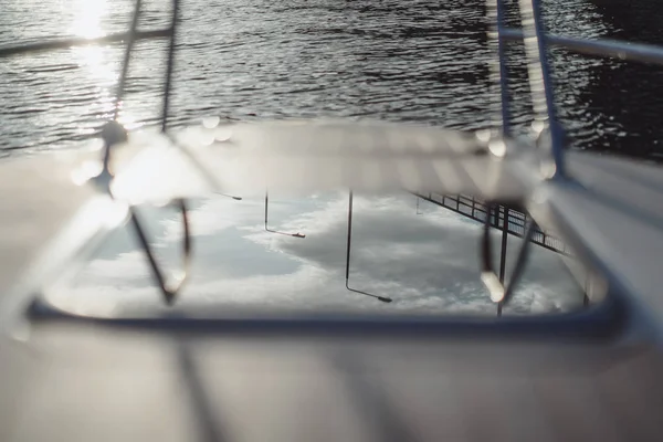 details of the yacht, deck, reflection of the sky.